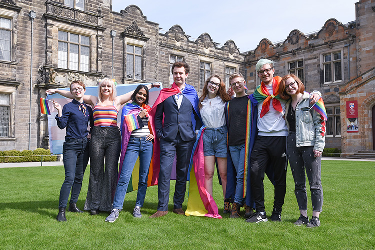 Students with a rainbow flag