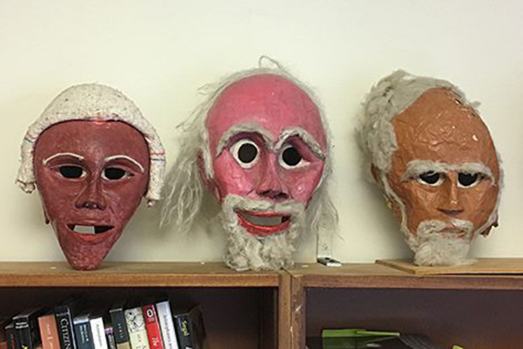 three actors' masks depicting old men