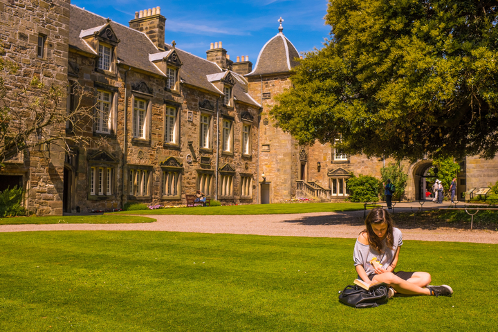 Girl reading in St Mary's Quad